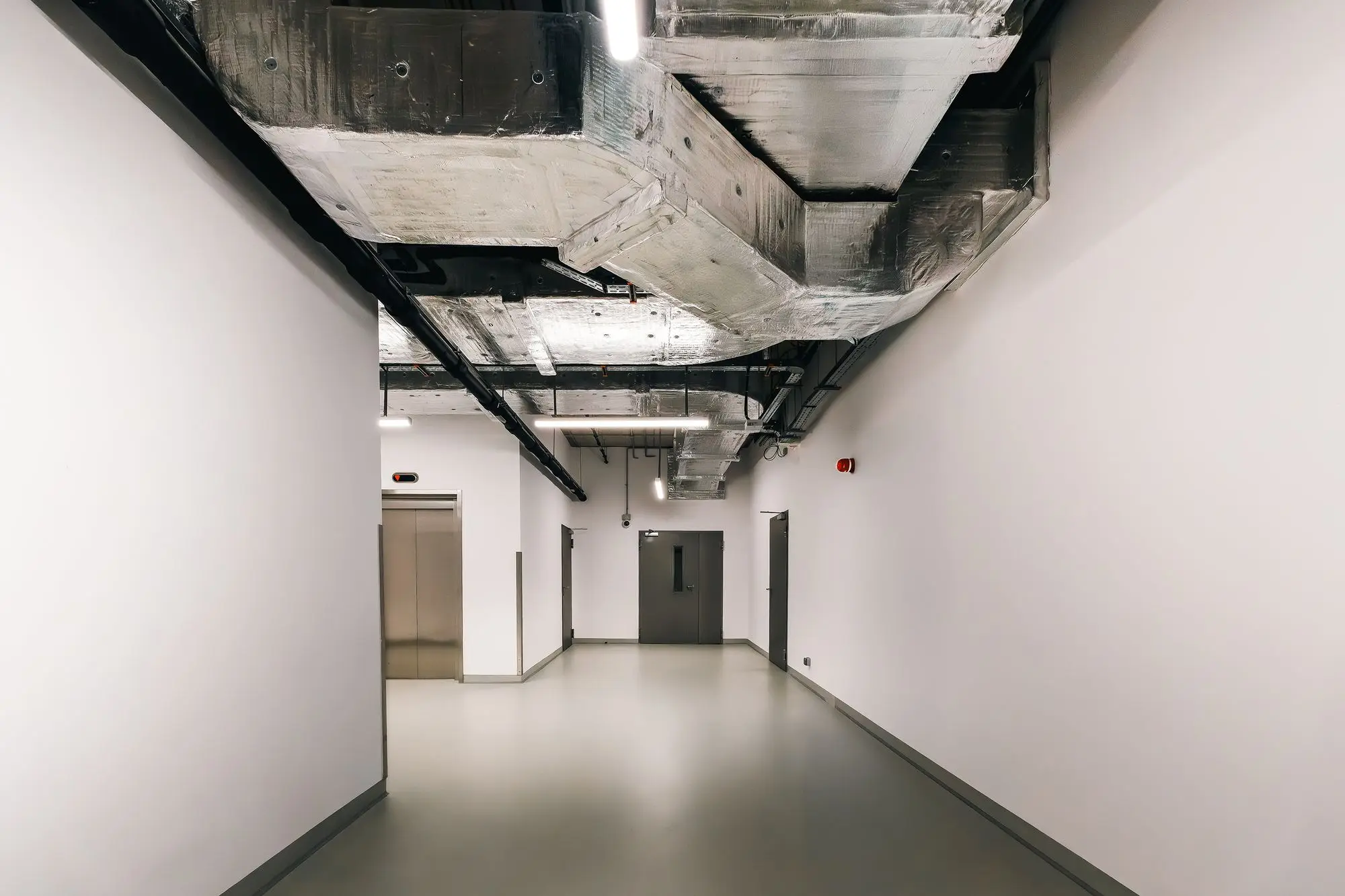 Commercial exposed HVAC ductwork in a Richardson DFW Telecom Corridor office building