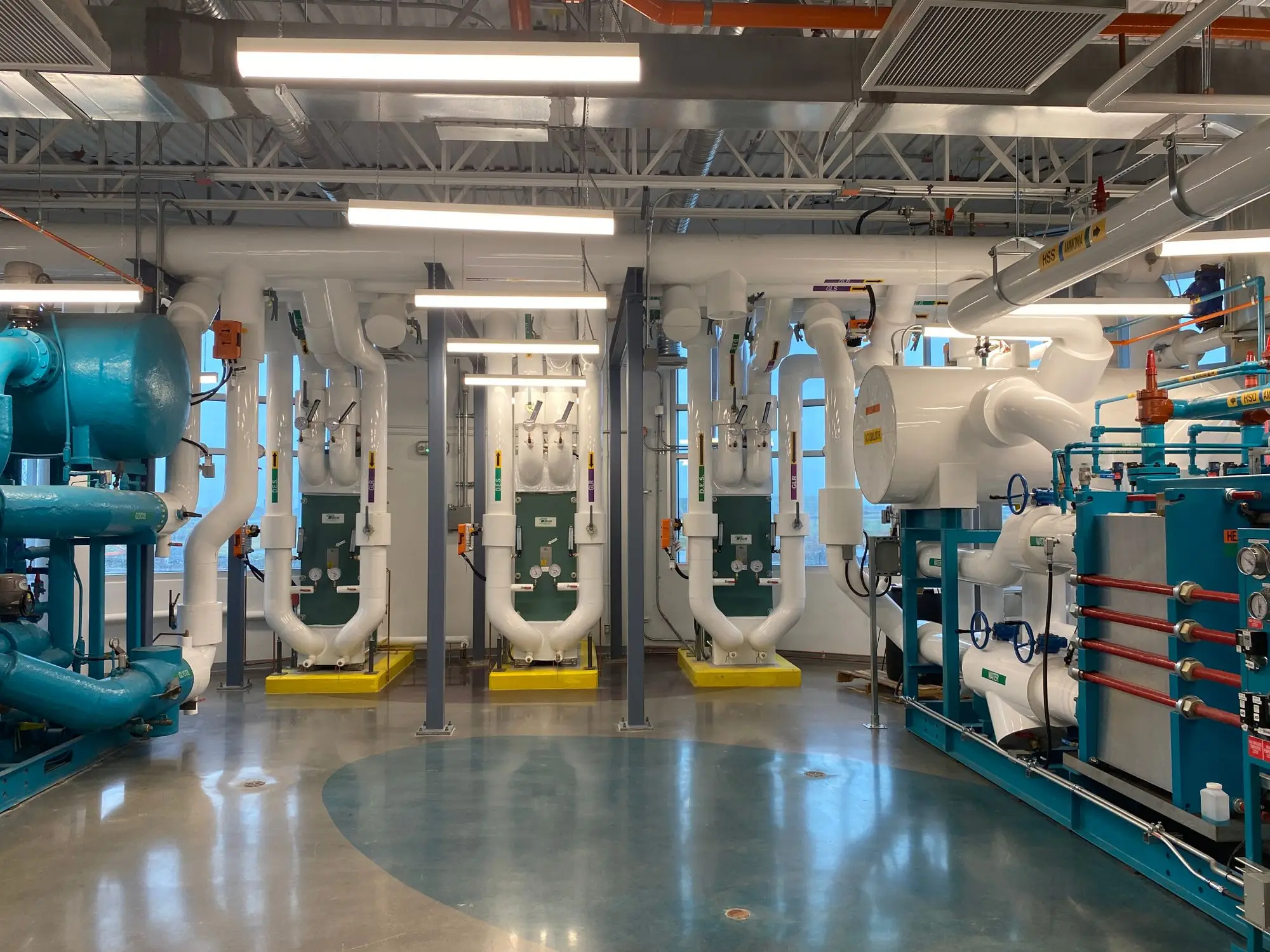 Commercial HVAC mechanical room with piping and equipment in a Dallas-Fort Worth building