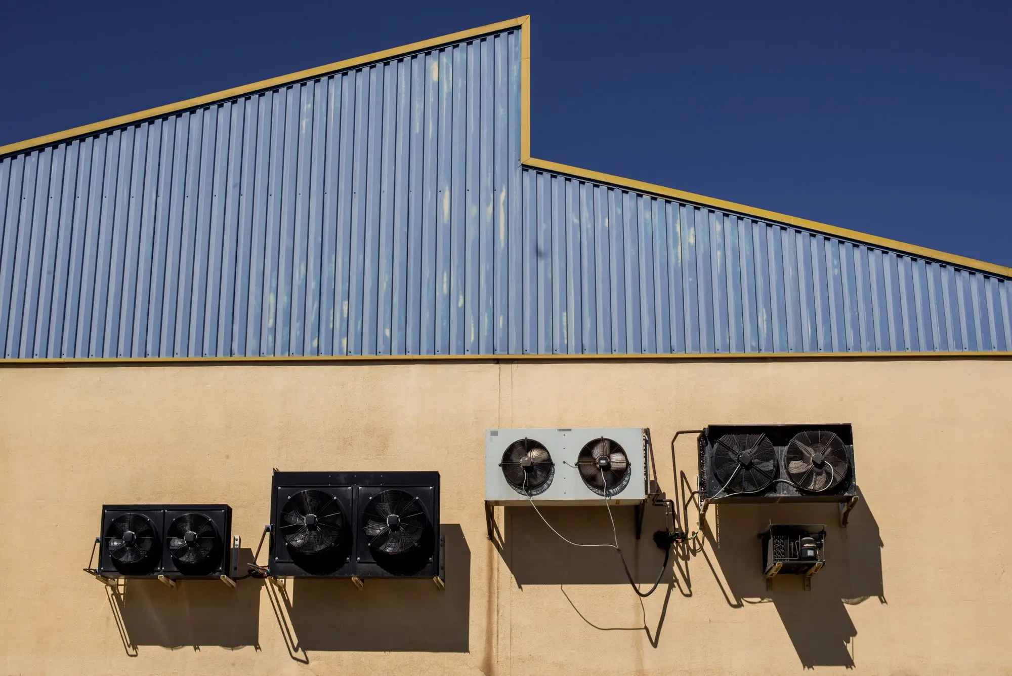 Commercial warehouse and retail building exterior HVAC units in the Arlington DFW area