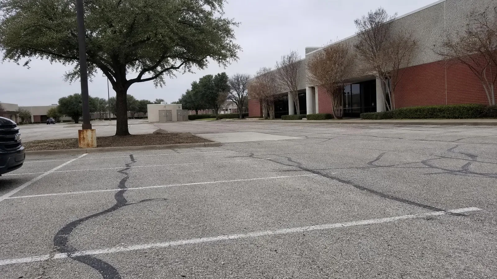 Parking lot serving a multi-tenant flex office park in Dallas-Fort Worth